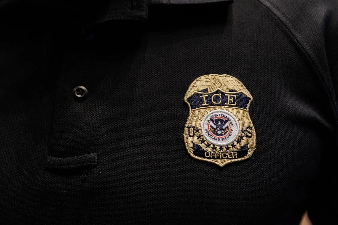 The badge of a U.S. Immigration and Customs Enforcement (ICE) is embroidered on a polo shirt of an ICE employee, in Arlington, Texas, U.S. August 26, 2025.  REUTERS/Shelby Tauber/File Photo