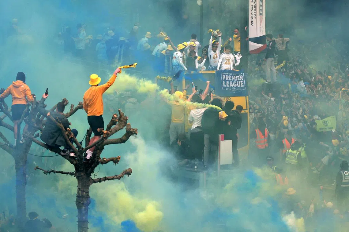 Leeds United players celebrating on the bus during the victory parade in Leeds, Britain, on May 5, 2025.