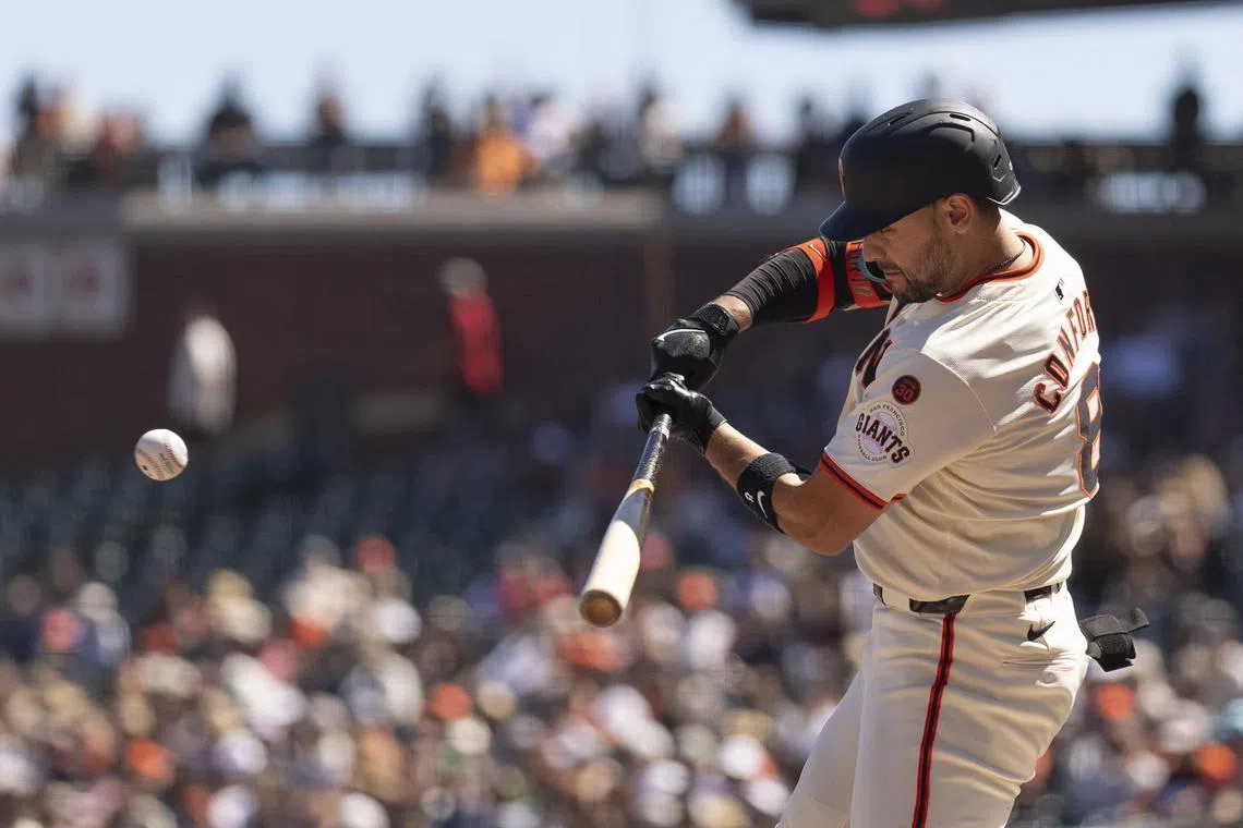 FILE PHOTO: Sep 5, 2024; San Francisco, California, USA;  San Francisco Giants outfielder Michael Conforto (8) hits a double during the sixth inning against the Arizona Diamondbacks at Oracle Park. Mandatory Credit: Stan Szeto-Imagn Images/File Photo
