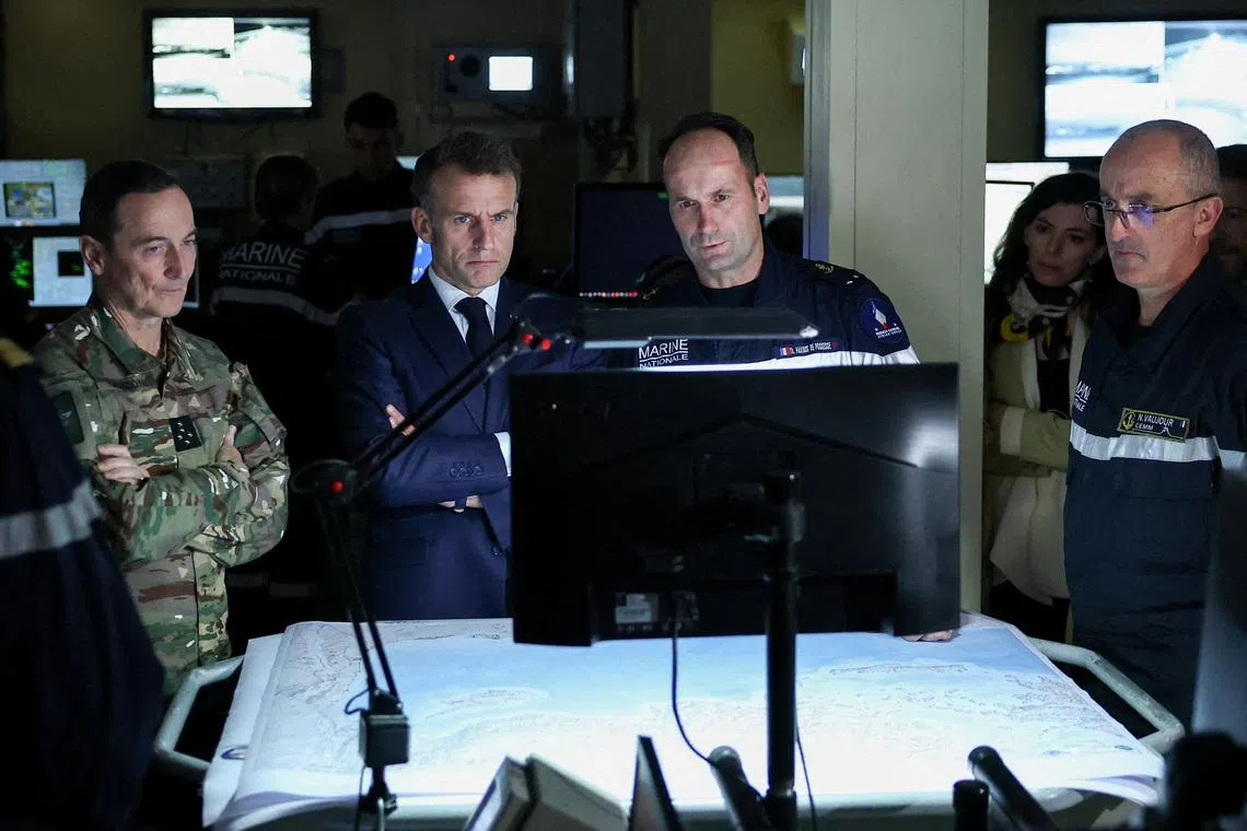 French President Emmanuel Macron visits the bridge of the French aircraft carrier Charles de Gaulle, on the day of his visit to Cyprus, showing France's solidarity after recent drone attacks amid the U.S.-Israeli conflict with Iran, and aimed at reinforcing European security in the Eastern Mediterranean, on the Mediterranean Sea. REUTERS/Gonzalo Fuentes/Pool