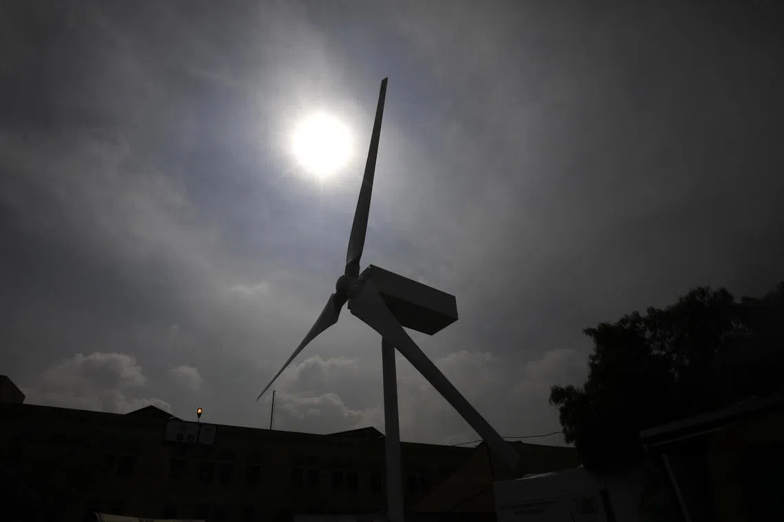 epa10947930 A model of wind turbine is on display during a renewable energy expo in Sana'a, Yemen, 29 October 2023. Many Yemenis have turned to the sun and other renewable energy sources for meeting basic needs and providing vital services, including urgently needed access to safe water and health care, since the nine year-conflict and skyrocketing prices of fuel have caused this Arab country to completely lose the electricity public services. The World Bank, the United Nations and the Yemen electricity services have installed hundreds of solar energy systems in schools, health facilities and other public facilities in the humanitarian crisis-affected communities, especially in rural areas, where around 70 percent of Yemen’s 30 million-population lives and where electricity remains a major part of the current development crisis, the United Nations has reported. The expo runs from 29 to 31 October 2023.  EPA-EFE/YAHYA ARHAB