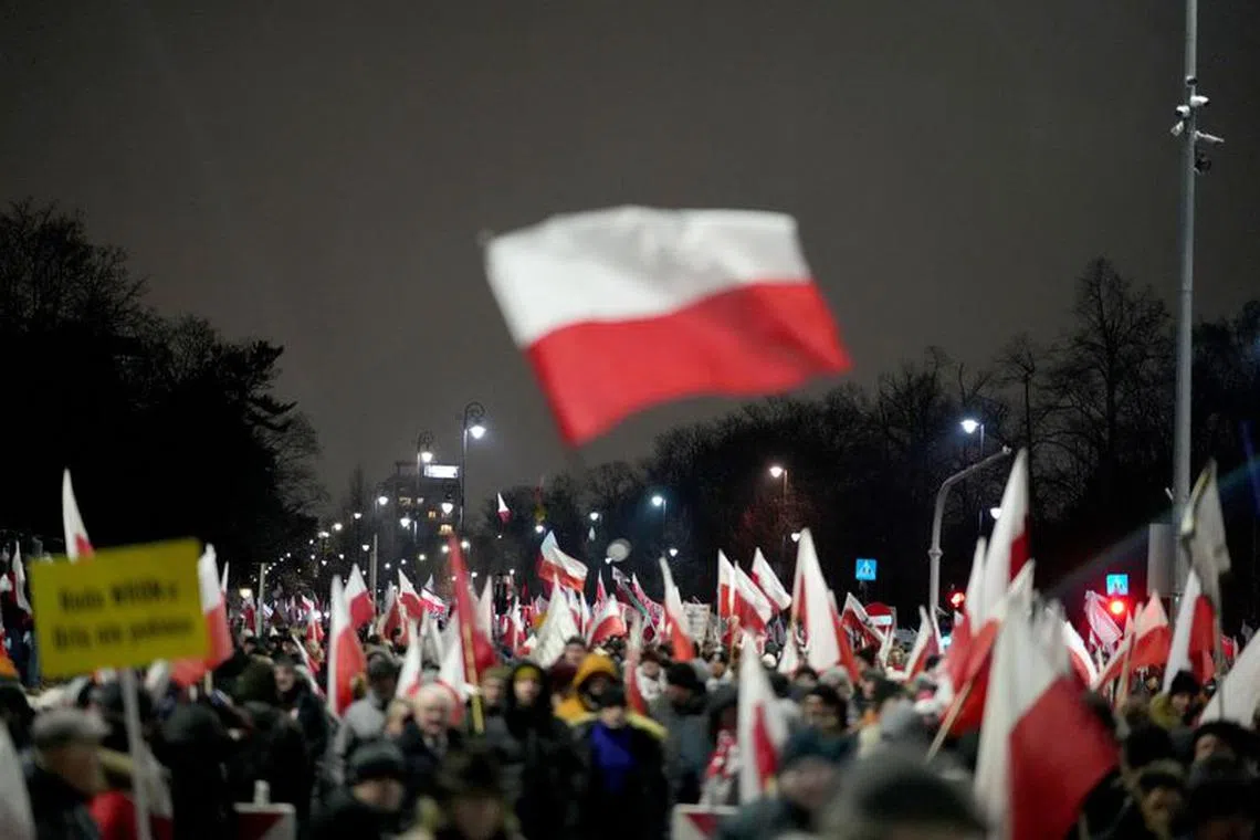 Supporters of the Law and Justice (PiS) party gather in protest against state media overhaul and arrest of former interior minister and his deputy in Warsaw, January 11, 2024. REUTERS/Aleksandra Szmigiel/File Photo