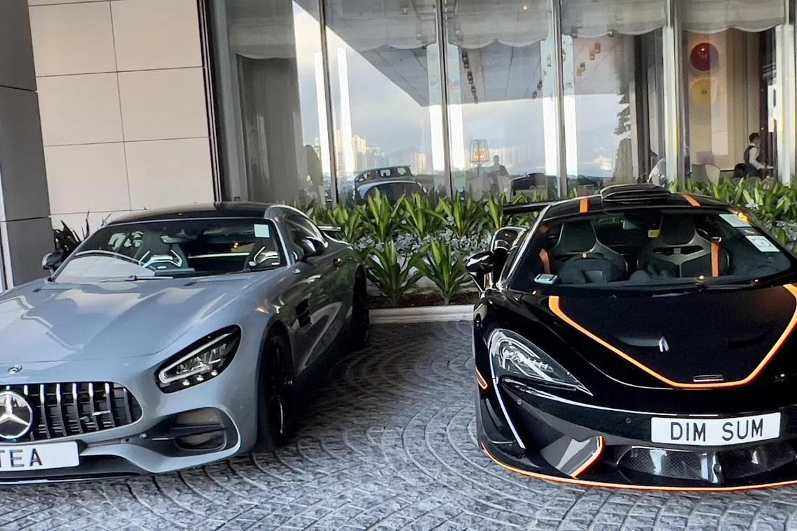 mfletter - Two luxury cars side by side bearing the plates TEA and DIM SUM in Hong Kong. Credit: @aublumber/X