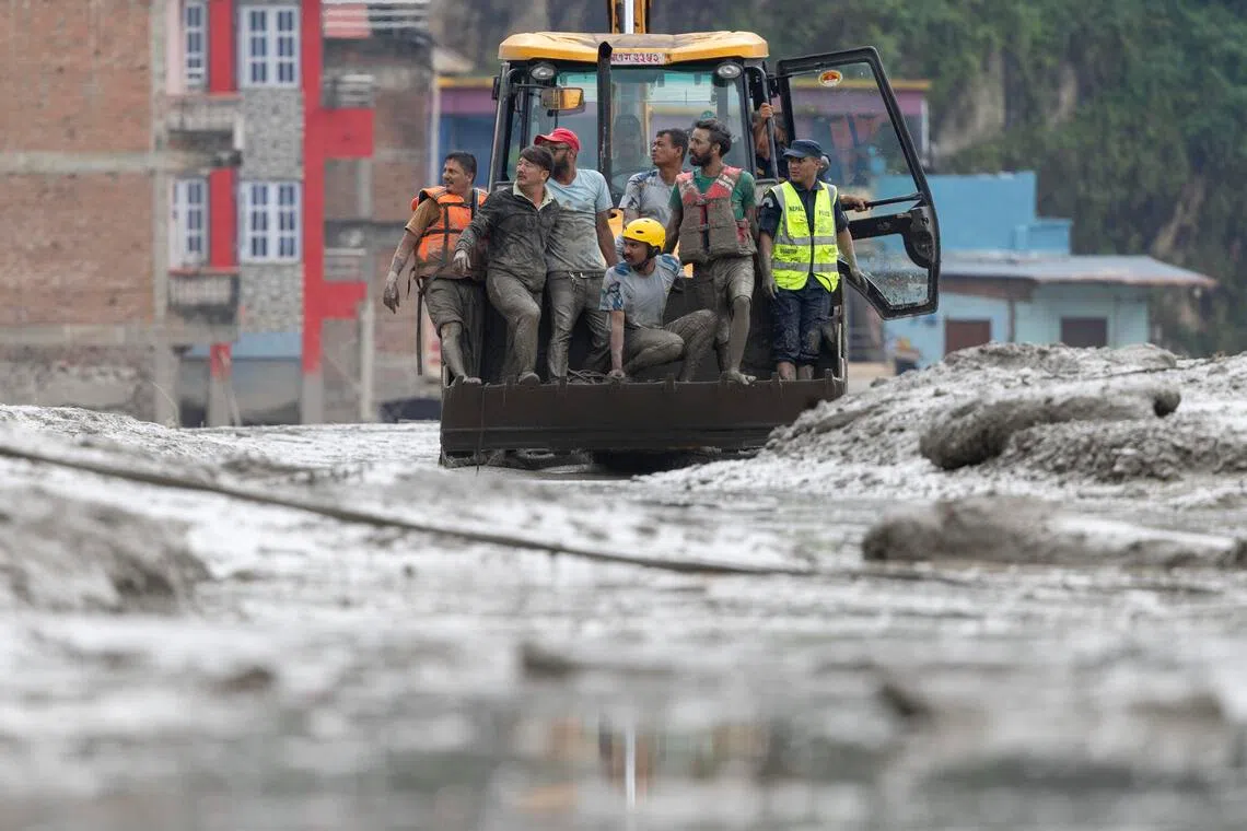 Flash flooding has killed at least 95 people in Nepal, and hundreds - including many foreigners - are missing.