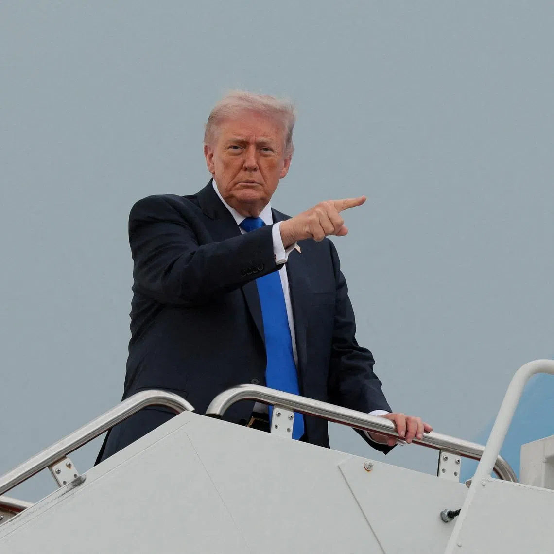 FILE PHOTO: U.S. President Donald Trump boards Air Force One en route to Palm Beach International Airport, at Joint Base Andrews, Maryland, U.S., April 24, 2026.