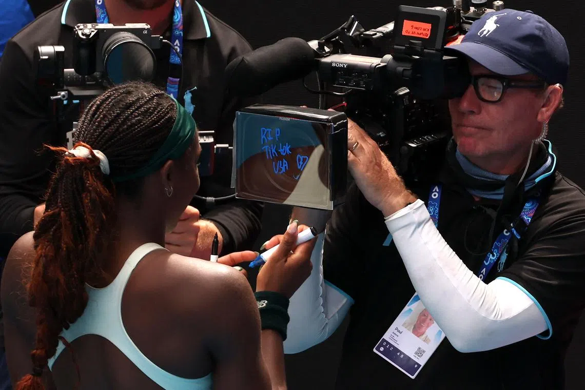 American tennis start Coco Gauff writing "RIP TikTok USA" on a screen at the Australian Open in Melbourne, on Jan 19.