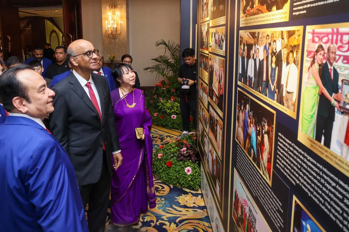 President Tharman Shanmugaratnam (second from left) and his wife Jane Ittogi viewing an exhibition at SICCI's gala dinner on May 4.
