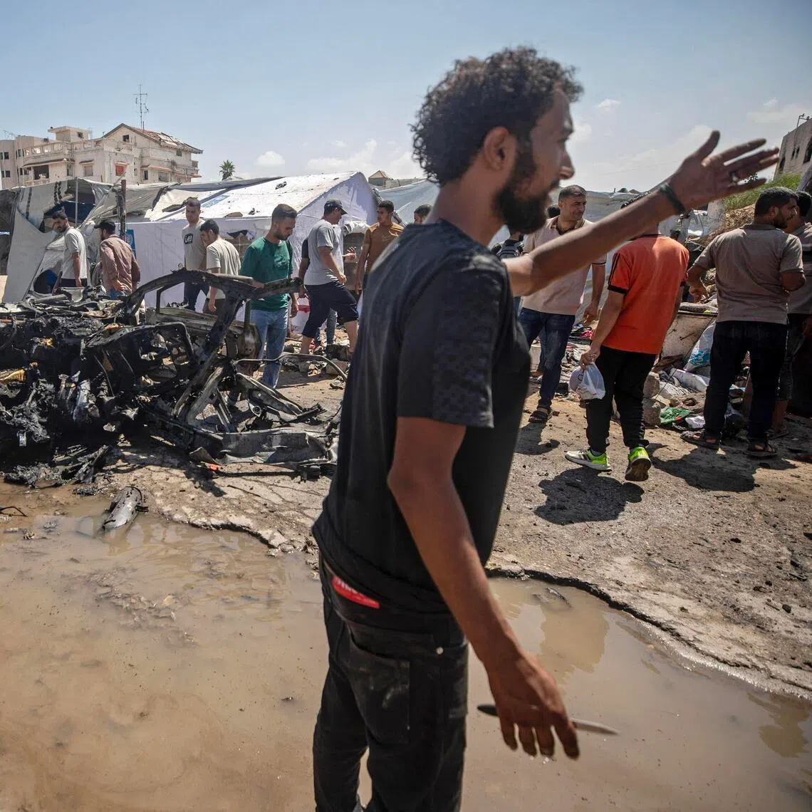 Locals gathering at the site of an Israeli airstrike in Gaza City on Sept 1.