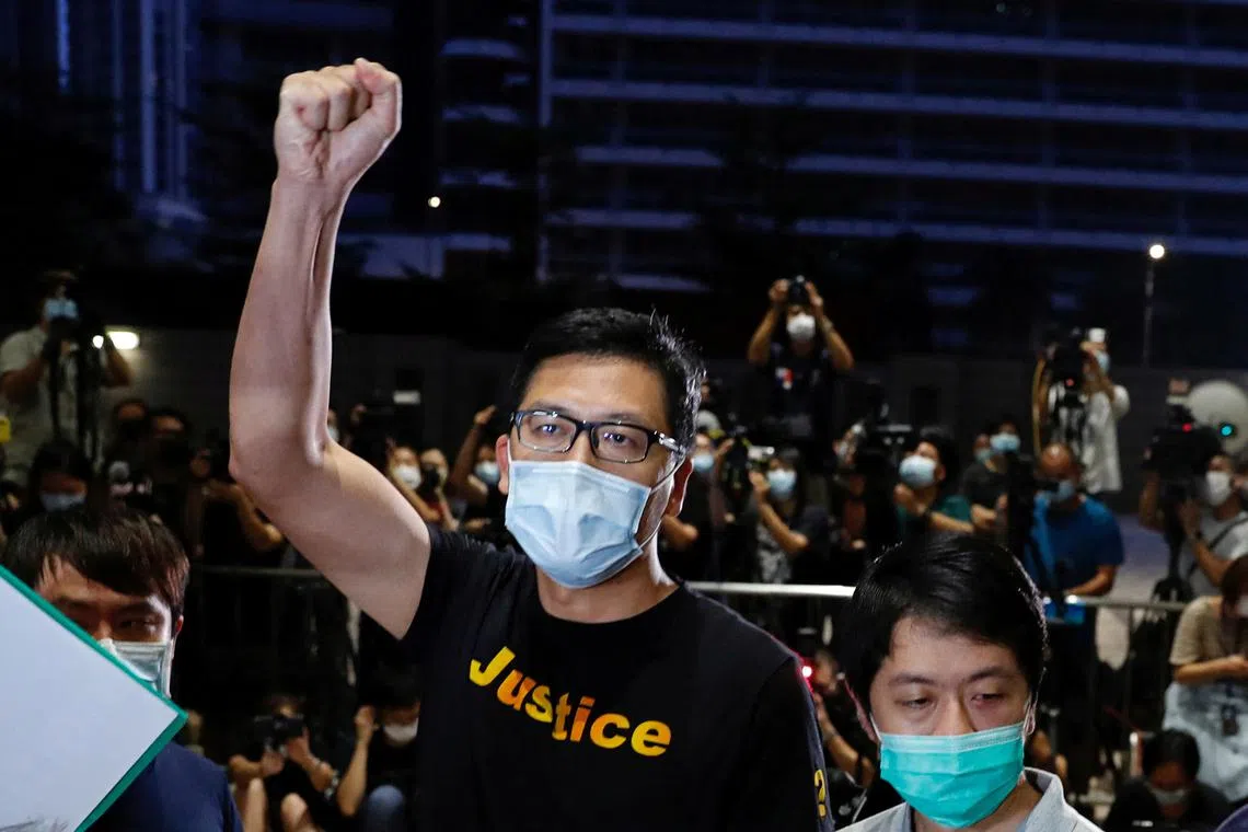 FILE PHOTO: Democratic Party lawmakers Lam Cheuk-ting and Ted Hui Chi-fung react after being released on bail over anti-government protests in July 2019 at West Kowloon Magistrates' Courts, in Hong Kong, China August 27, 2020. REUTERS/Tyrone Siu/File Photo