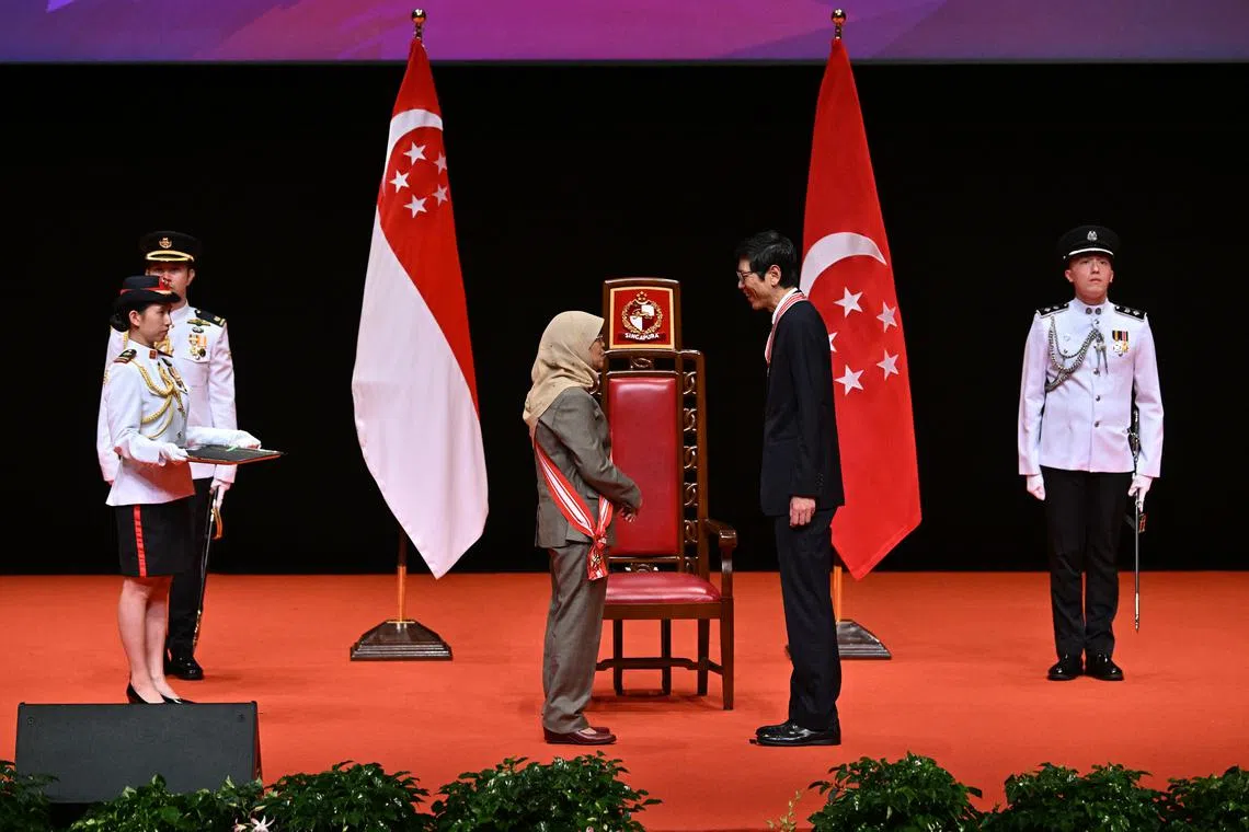 Professor Tan Chorh Chuan receiving the Distinguished Service Order from President Halimah Yacob on Sunday.