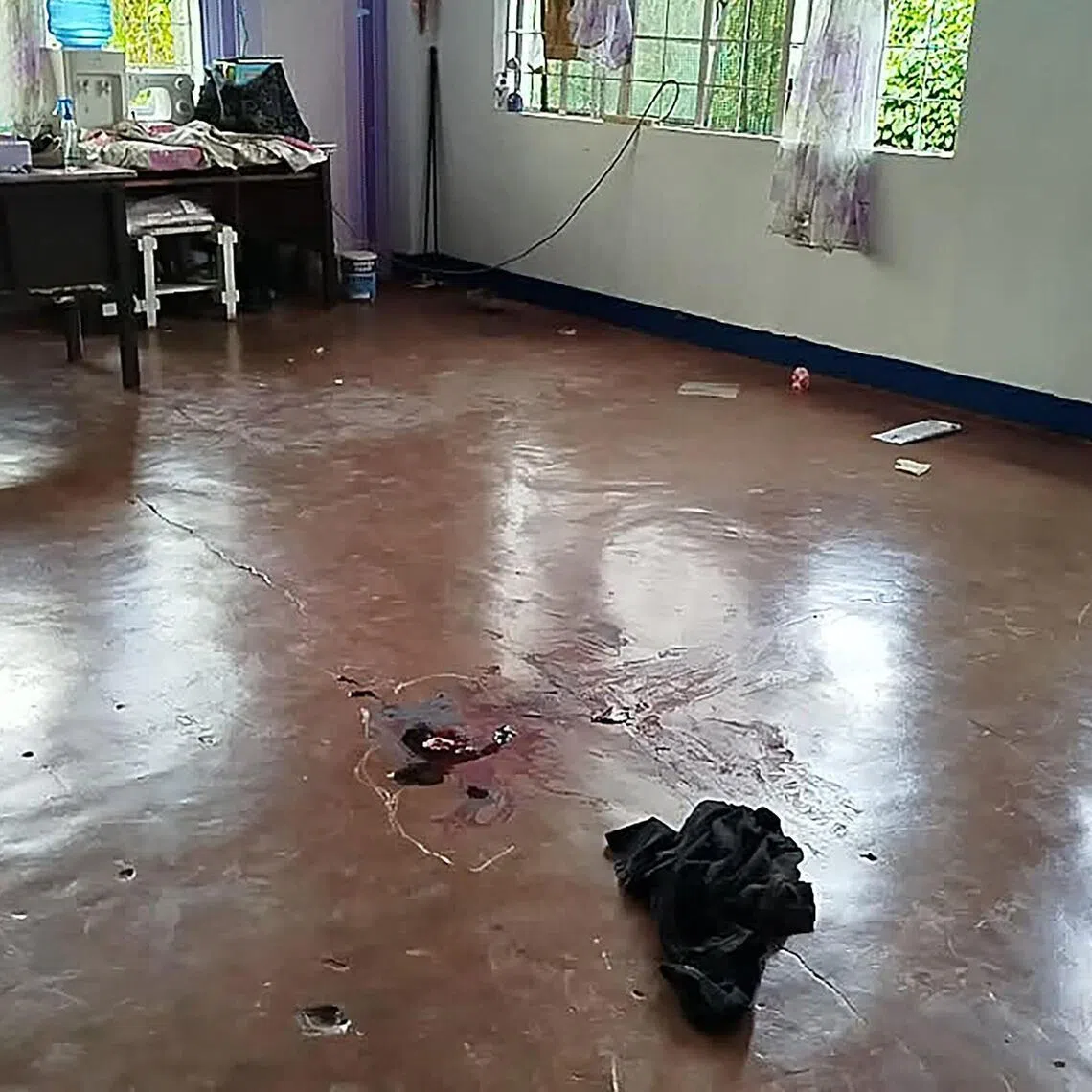 This photo taken on June 22 shows blood on the floor in a classroom after a shooting incident at San Jose High School in Tacloban City, Leyte province in the central Philippines.