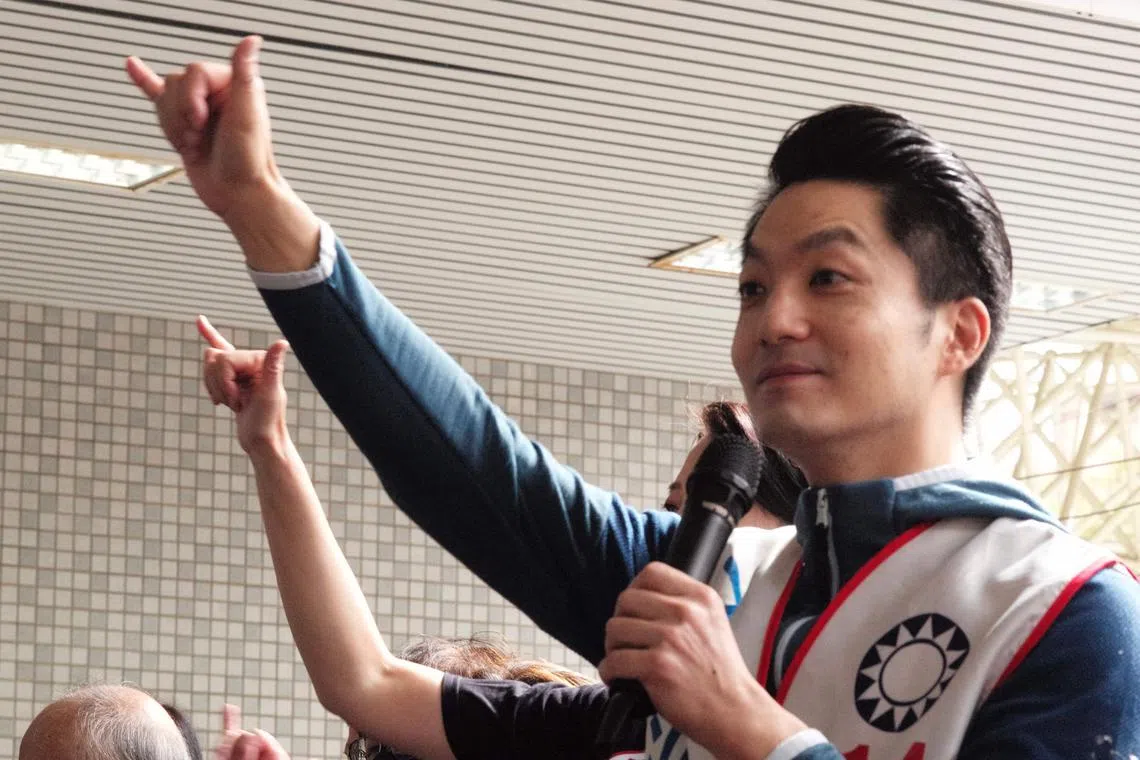 Chiang Wan-an, grandson of the late president Chiang Kai-shek from the main opposition Kuomintang (KMT) gestures during an elections campaign in New Taipei City on Nov 5, 2022.  