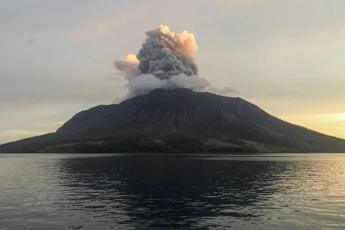 Mount Ruang volcano spews volcanic ash as seen from Tagulandang on April 19. 