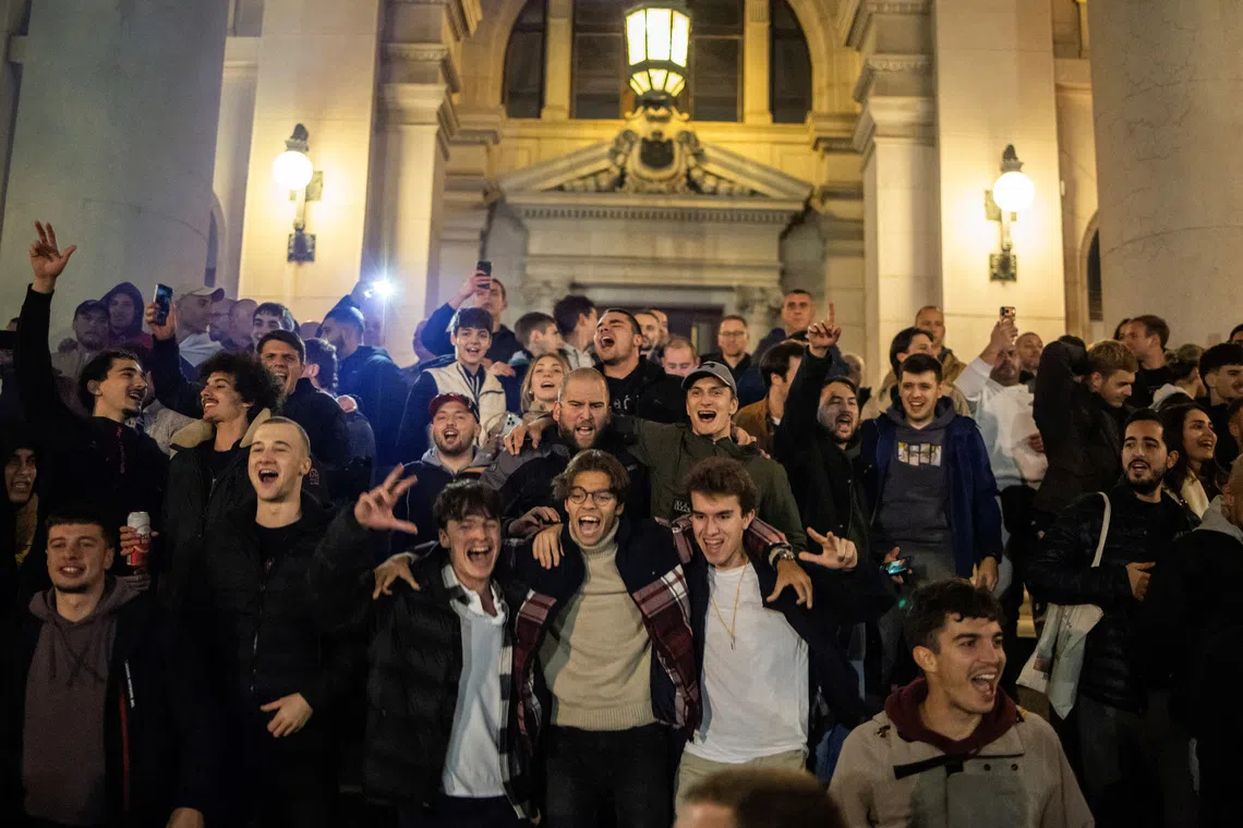 Supporters of the electoral list \"Student List - Students Win\" celebrate at the Parliament building after Aleksandar Vucic, Serbian Progressive Party (SNS) prime ministerial candidate, conceded defeat in the parliamentary election in Belgrade, Serbia, October 25, 2026. REUTERS/Marko Djurica