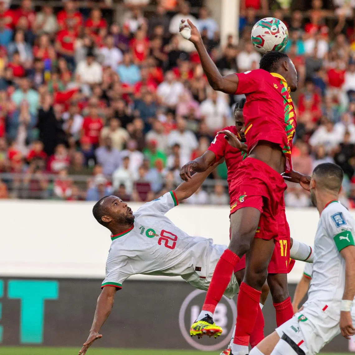 Morocco's Ayoub El Kaabi (left) and Hakim Ziyech challenging Moussavou Dechan of Congo in their World Cup 2026 qualifier in Agadir, Morocco, on June 11, 2024.