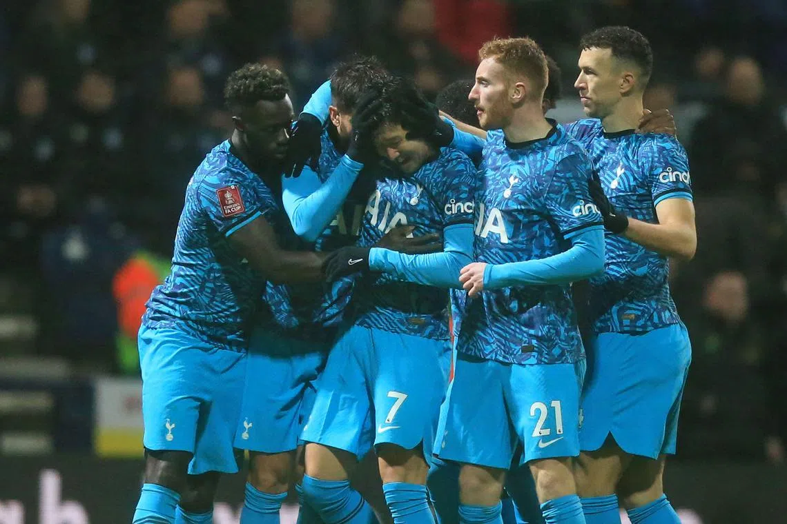 Tottenham striker Son Heung-Min (centre) celebrates with teammates after scoring the opening goal.