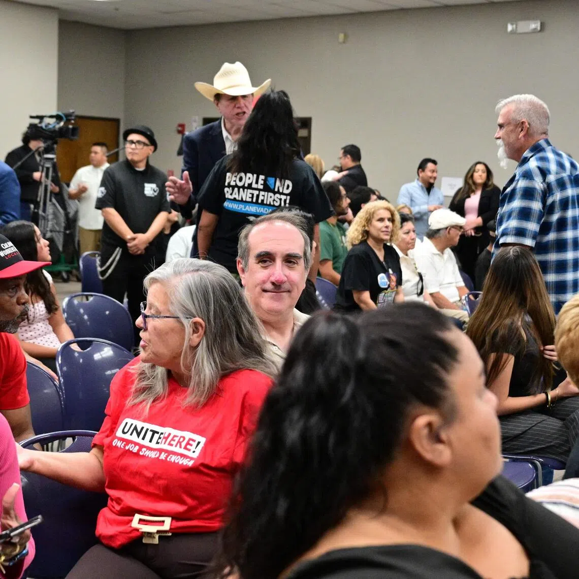 Aaron Mahan (centre), a worker on the Las Vegas strip, attends a town hall meeting in Las Vegas on Aug 19. Mahan considers himself a victim of the “Trump slump”.