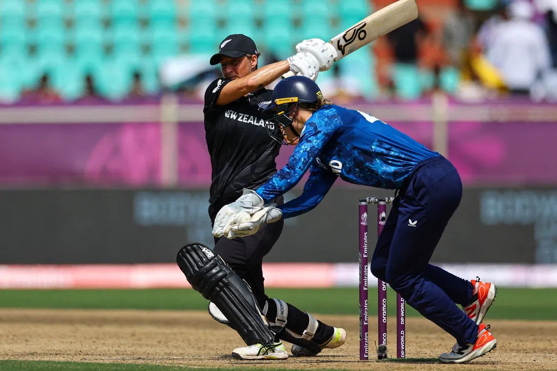 Cricket - ICC Women's World Cup - England v New Zealand - Dr YS Rajasekhara Reddy ACA-VDCA Cricket Stadium, Visakhapatnam, India - October 26, 2025 New Zealand's Sophie Devine in action with England's Amy Jones REUTERS/Anushree Fadnavis