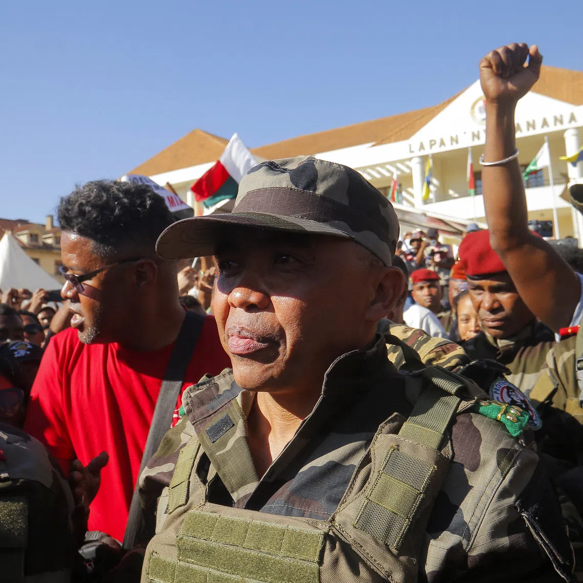 Colonel Michael Randrianirina arrives with members of the military to join protesters gathered outside the town hall on Independence Avenue during a nationwide youth-led demonstration against frequent power outages and water shortages, in Antananarivo, Madagascar, October 14, 2025. REUTERS/Zo Andrianjafy