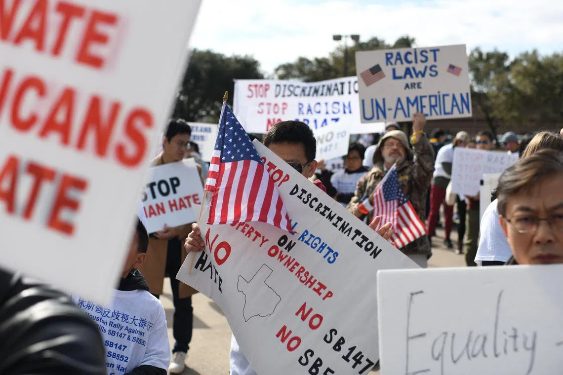 Demonstrators hold a protest in Houston, Texas, against a bill that would forbid Chinese nationals from buying properties in Texas, on Feb 11, 2023. 