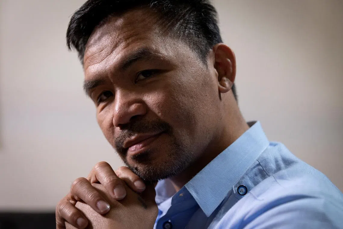 FILE PHOTO: Presidential candidate and former boxing champion Manny Pacquiao poses for a photograph during an interview with Reuters at his campaign headquarters in Makati City, Philippines, April 7, 2022. Picture taken April 7, 2022. REUTERS/Eloisa Lopez/File Photo
