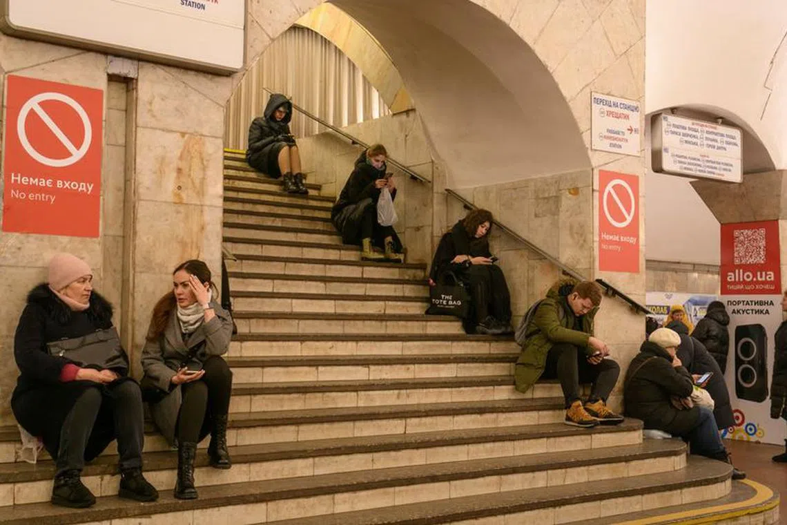 People taker shelter inside a metro station during a Russian missile strike, amid Russia's attack on Ukraine, in Kyiv, Ukraine December 14, 2023. REUTERS/Vladyslav Musiienko