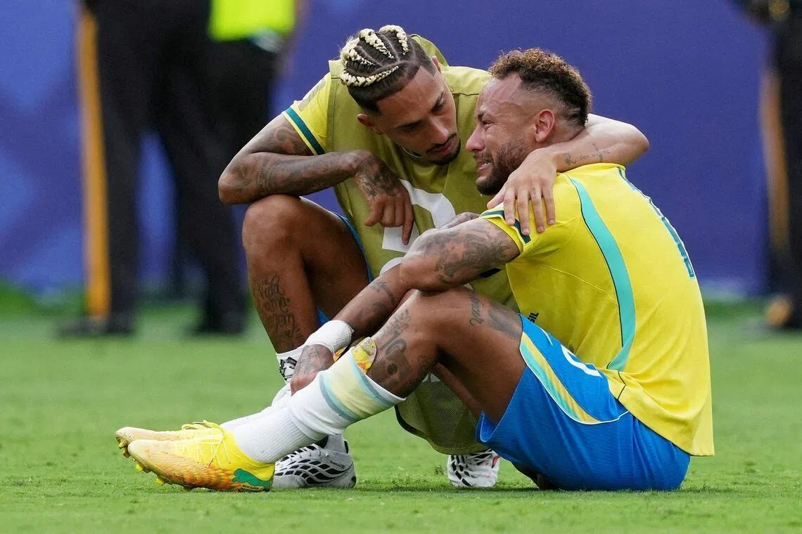 Brazil’s Raphinha comforts a tearful Neymar after Brazil are eliminated from the World Cup.