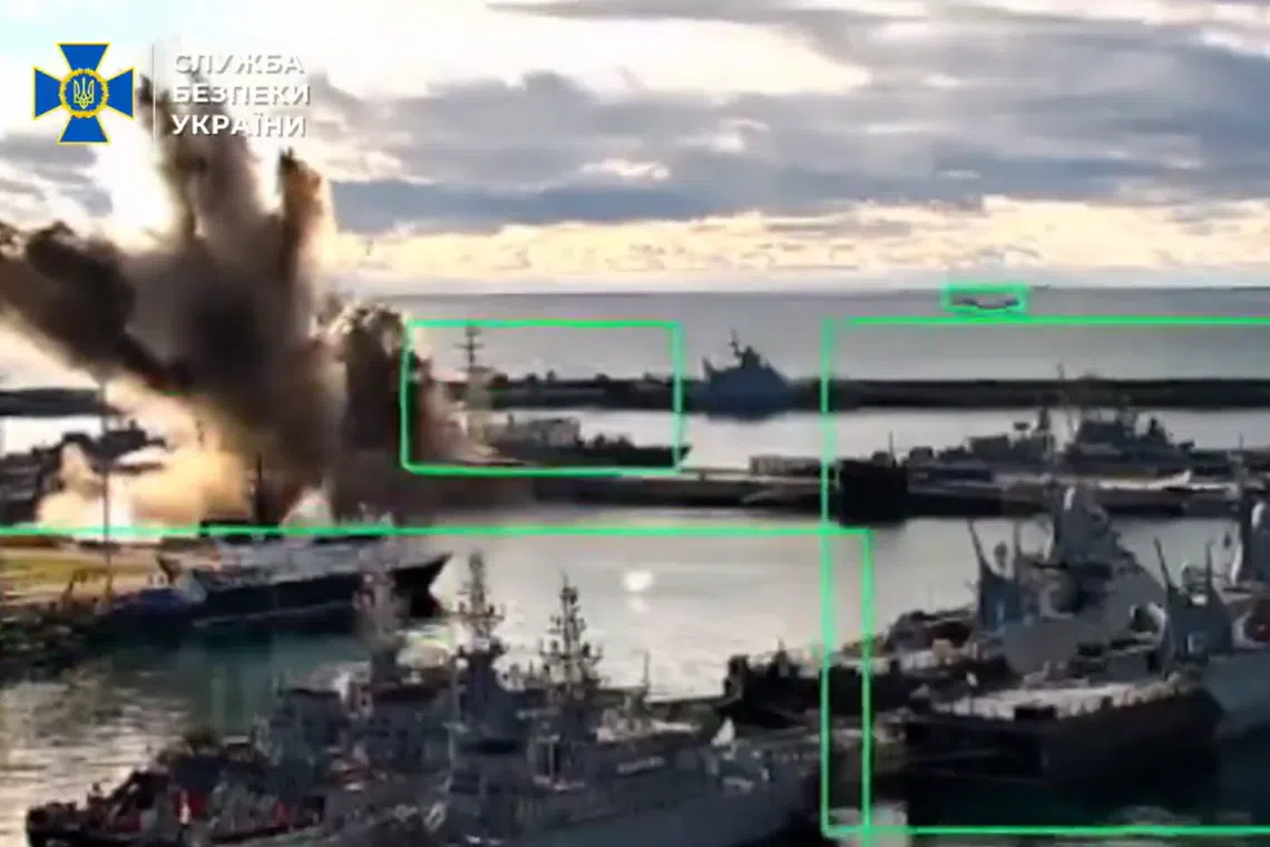 Screengrab from a video showing a powerful explosion erupting ​from the ​water at the port of ‍Novorossiysk where Russian naval vessels were docked.