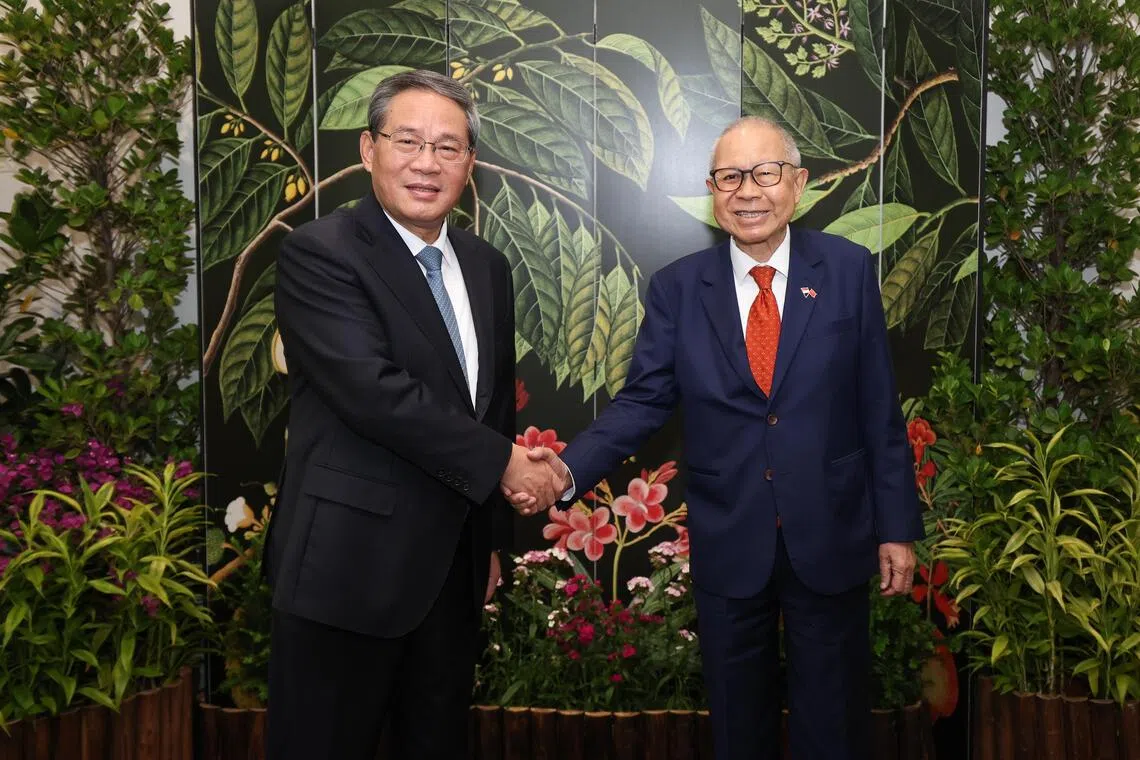 Chinese Premier Li Qiang (left) calling on Acting President Eddie Teo at the Istana on Oct 26.