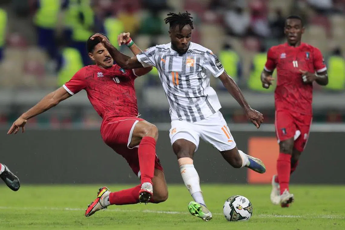 Soccer Football - Africa Cup of Nations - Group E - Equatorial Guinea v Ivory Coast - Stade de Japoma, Douala, Cameroon - January 12, 2022 Ivory Coast's Maxwel Cornet in action with Equatorial Guinea's Saul Coco REUTERS/Thaier Al-Sudani/File Photo