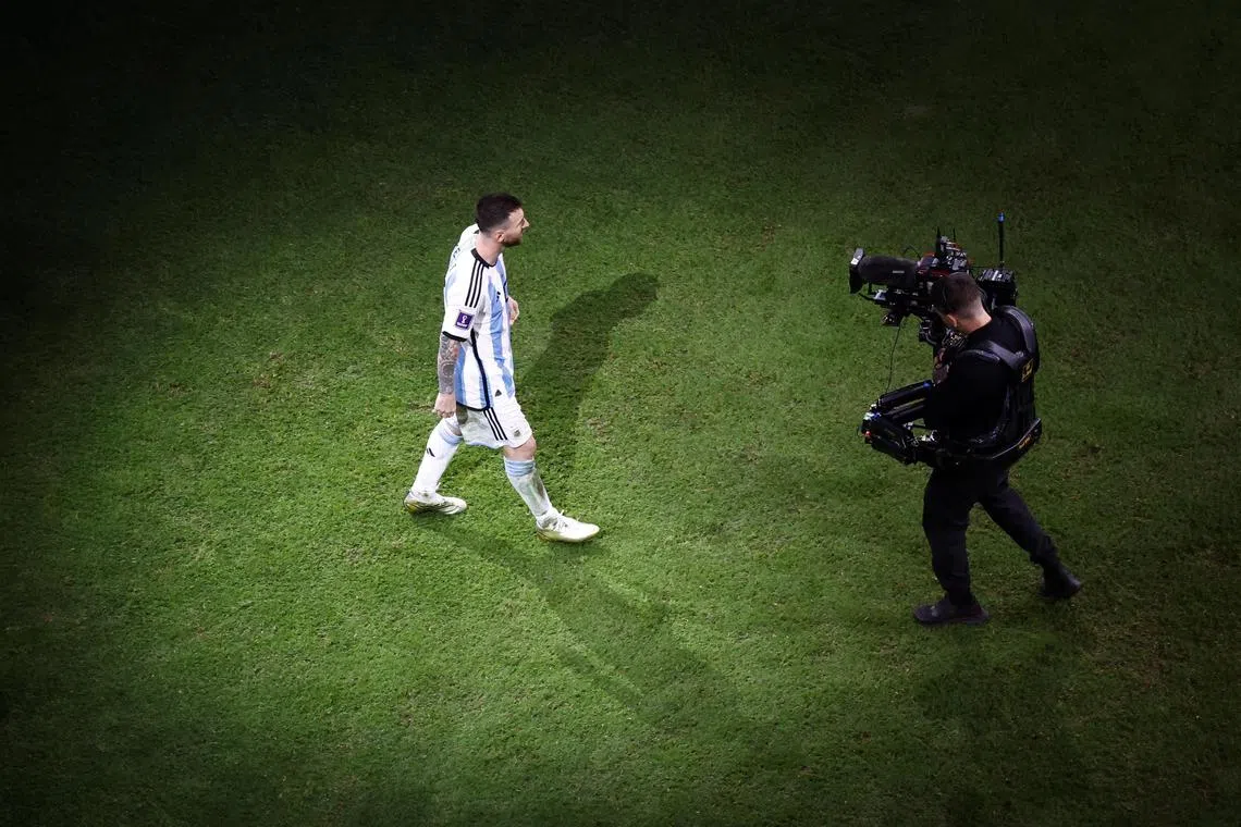 Soccer Football - FIFA World Cup Qatar 2022 - Final - Argentina v France - Lusail Stadium, Lusail, Qatar - December 18, 2022
Argentina's Lionel Messi approaches the stage before receiving his medal after winning the World Cup REUTERS/Peter Cziborra