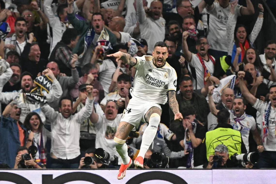 Real Madrid forward Joselu celebrates scoring his team's second goal.
