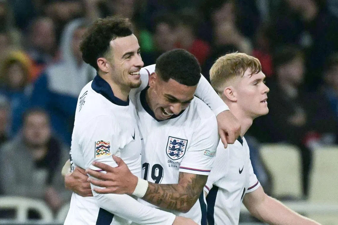 England's Curtis Jones celebrates with Morgan Rogers after scoring his team's third goal in the 3-0 Nations League win over Greece.