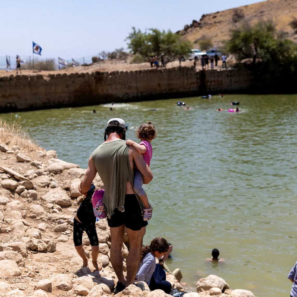 Israelis visit an ancient water reservoir in the Jordan Valley in the Israeli-occupied West Bank, August 5, 2026. REUTERS/Ronen Zvulun