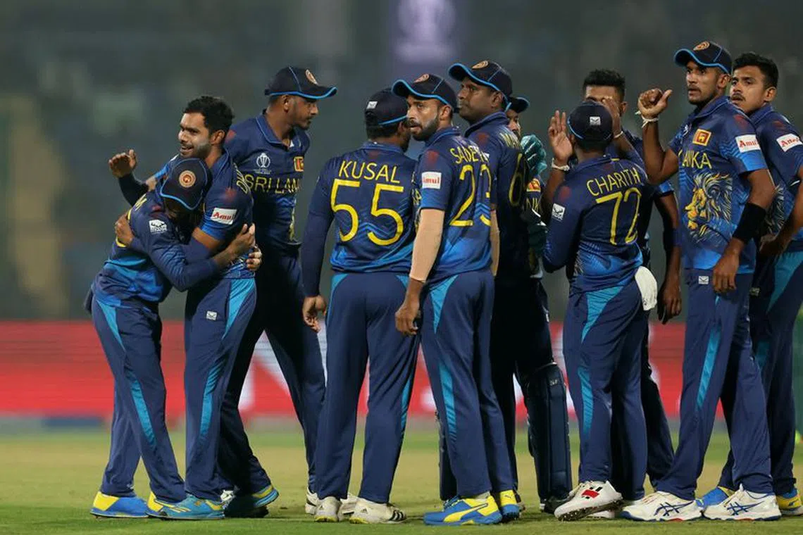 Cricket - ICC Cricket World Cup 2023 - Bangladesh v Sri Lanka - Arun Jaitley Stadium, New Delhi, India - November 6, 2023 Sri Lanka's Dilshan Madushanka celebrates with teammates after taking the wicket of Bangladesh's Tanzid Hasan, caught out by Pathum Nissanka REUTERS/Anushree Fadnavis