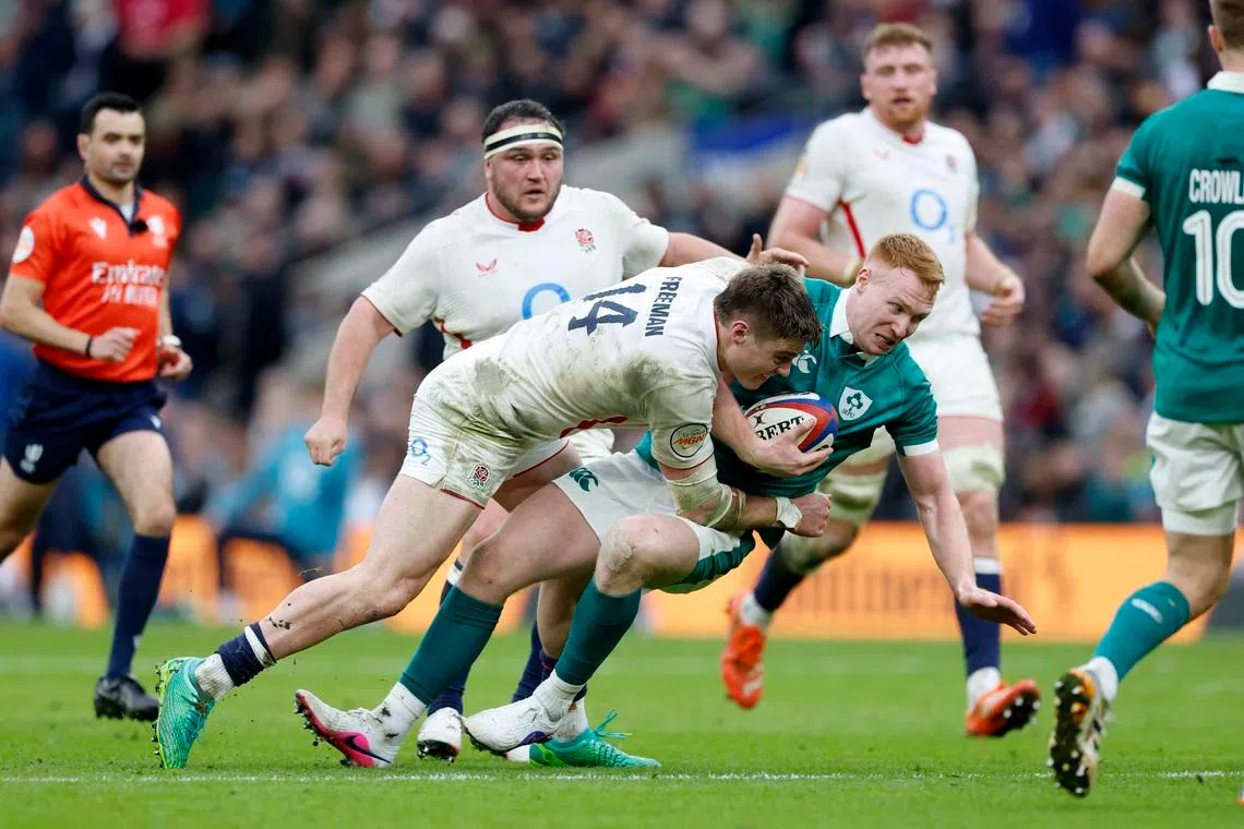Rugby Union - Six Nations Championship - England v Ireland - Allianz Stadium, Twickenham, Britain - February 21, 2026 England's Tommy Freeman in action with Ireland's Ciaran Frawley Action Images via Reuters/Peter Cziborra