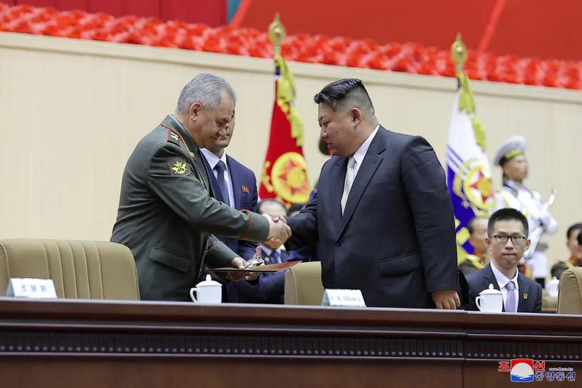 FILE PHOTO: Russia's Defense Minister Sergei Shoigu shakes hands with North Korean leader Kim Jong Un during an event marking the 70th anniversary of the Korean War armistice in Pyongyang, North Korea, in this image released by North Korea's Korean Central News Agency on July 28, 2023.   KCNA via REUTERS/ File Photo