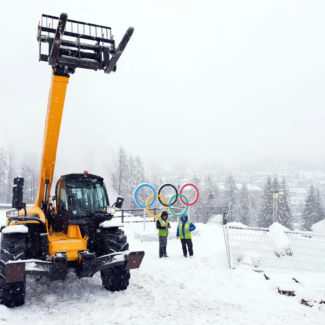 Feb 4, 2026; Cortina d'Ampezzo, ITALY; Construction crews work ahead of the Milano Cortina 2026 Olympic Winter Games at the Cortina Sliding Centre. Mandatory Credit: Eric Bolte-Imagn Images