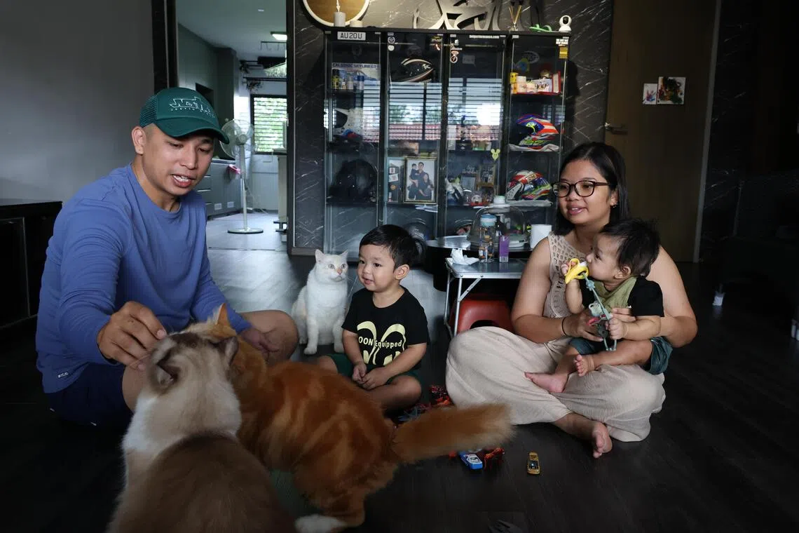 Young Firman Young Azman and Nadyrha Mat Ali with their two sons at their home in Jurong West.