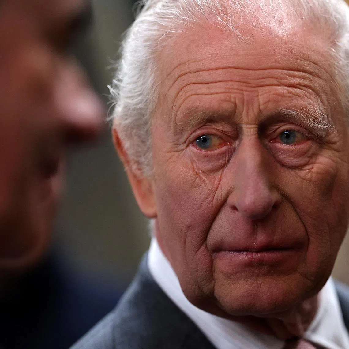Britain's King Charles meets members of the local community with during a visit to The Market Hall in St Austell, Britain, March 24, 2026.  ADRIAN DENNIS/Pool via REUTERS