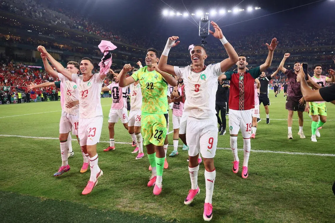 Soccer Football - FIFA World Cup 2026 - Round of 32 - Netherlands v Morocco - Estadio Monterrey, Monterrey, Mexico - June 29, 2026
Morocco's Soufiane Rahimi, Ahmed Reda Tagnaouti and teammates celebrate after the match as Morocco qualify for the Round of 16 stage of the World Cup REUTERS/Eloisa Sanchez     TPX IMAGES OF THE DAY
