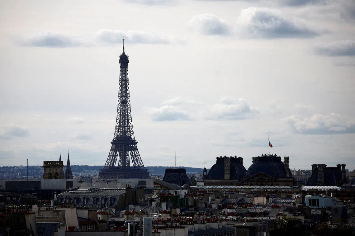 FILE PHOTO: A view shows the Eiffel Tower and rooftops of Paris, France, March 16, 2024. REUTERS/Sarah Meyssonnier/File Photo
