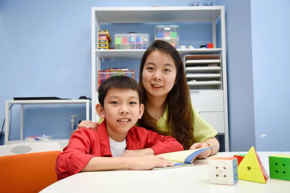 ST20240306_202447261425/vlmemory/Heng Yi-Hsin/Venessa Lee

Profile of Mason Zhou, 9, and his mother, Ms Xie Jin Vivian, 34, the operations manager at Mofunland, a children's rubiks cube-themed playground, at Neurobix Method on Mar 6, 2024. 

Mason takes memory coaching enrichment classes at Neurobix Method. 

ST PHOTO: HENG YI-HSIN