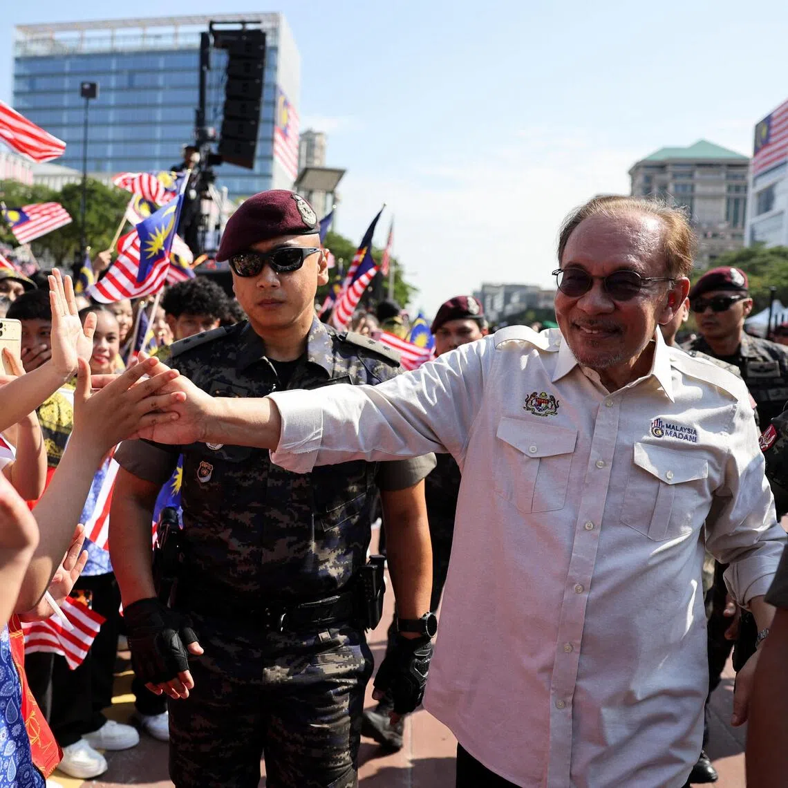 Malaysian Prime Minister Anwar Ibrahim greeting performers during the 69th Independence Day celebration in Putrajaya on Aug 31.