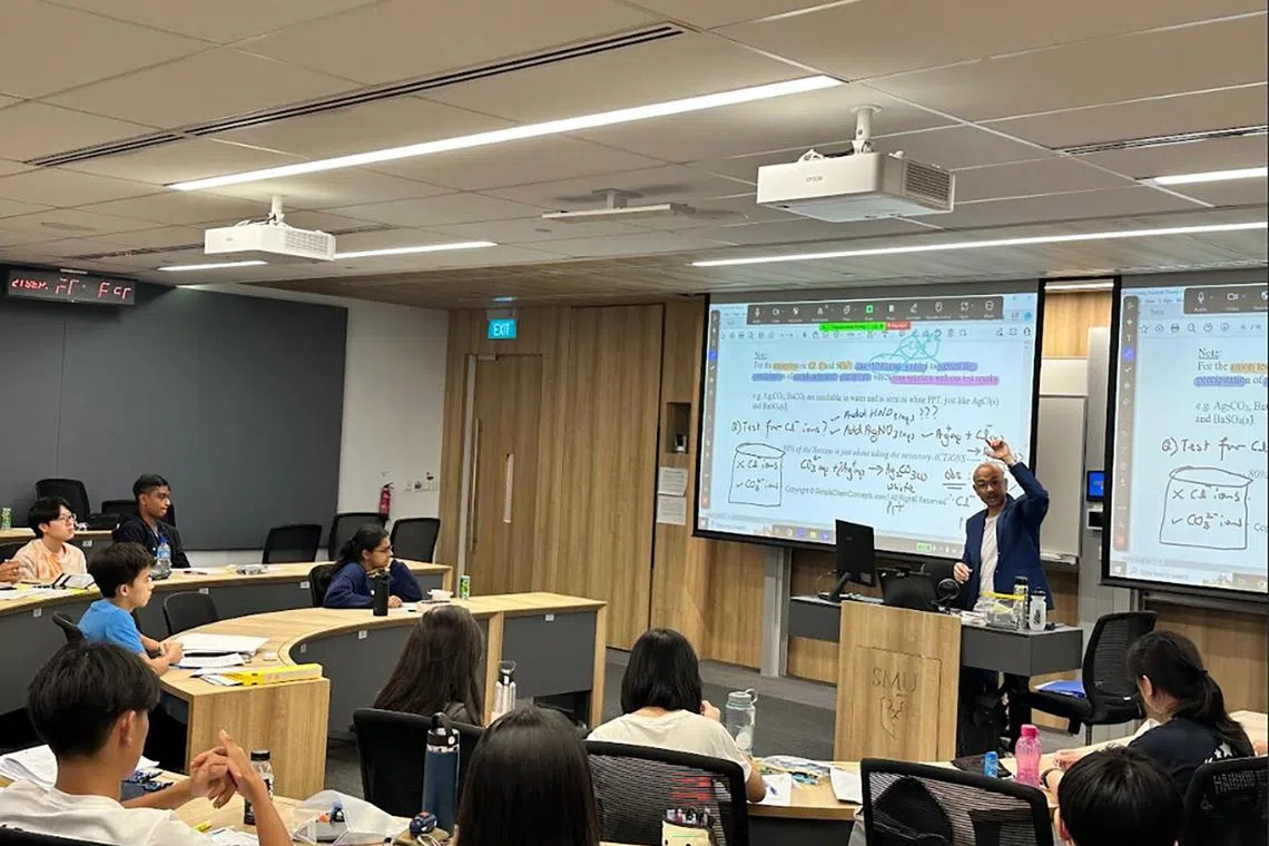 Mr Sean Chua, co-founder of Winners Education Centre, with his Chemistry tuition students.


Credit: Winners Education Centre