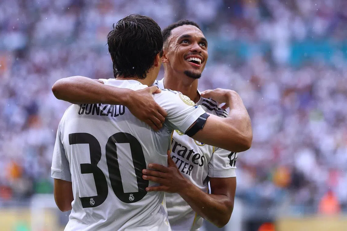 Real Madrid's Gonzalo Garcia celebrates scoring with Trent Alexander-Arnold in the 1-0 win over Juventus.