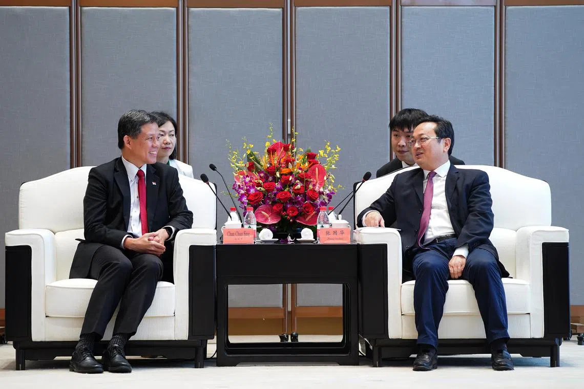 Singapore’s Education Minister and Minister-in-charge of the Public Service Chan Chun Sing (left) during a meeting with the area’s party chief Zhang Guohua.