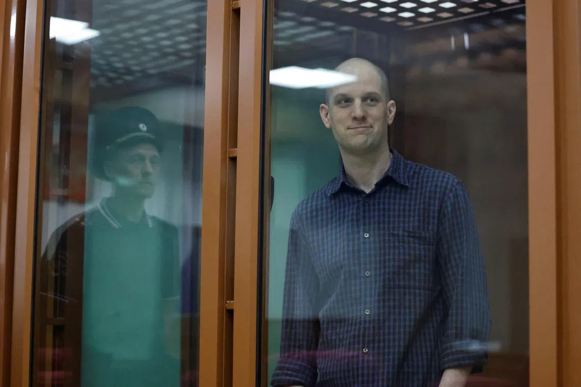 FILE PHOTO: Wall Street Journal reporter Evan Gershkovich, who stands trial on spying charges, is seen inside an enclosure for defendants before a court hearing in Yekaterinburg, Russia June 26, 2024. REUTERS/Evgenia Novozhenina/File Photo