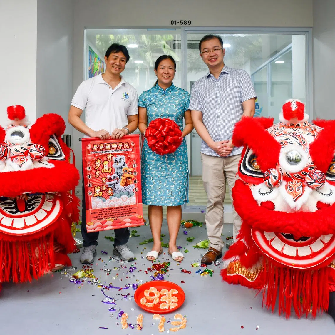 Workers' Party MPs (from left) Jamus Lim, He Ting Ru, and Louis Chua at the opening of Sengkang Town Council's new branch office on March 18, 2023.