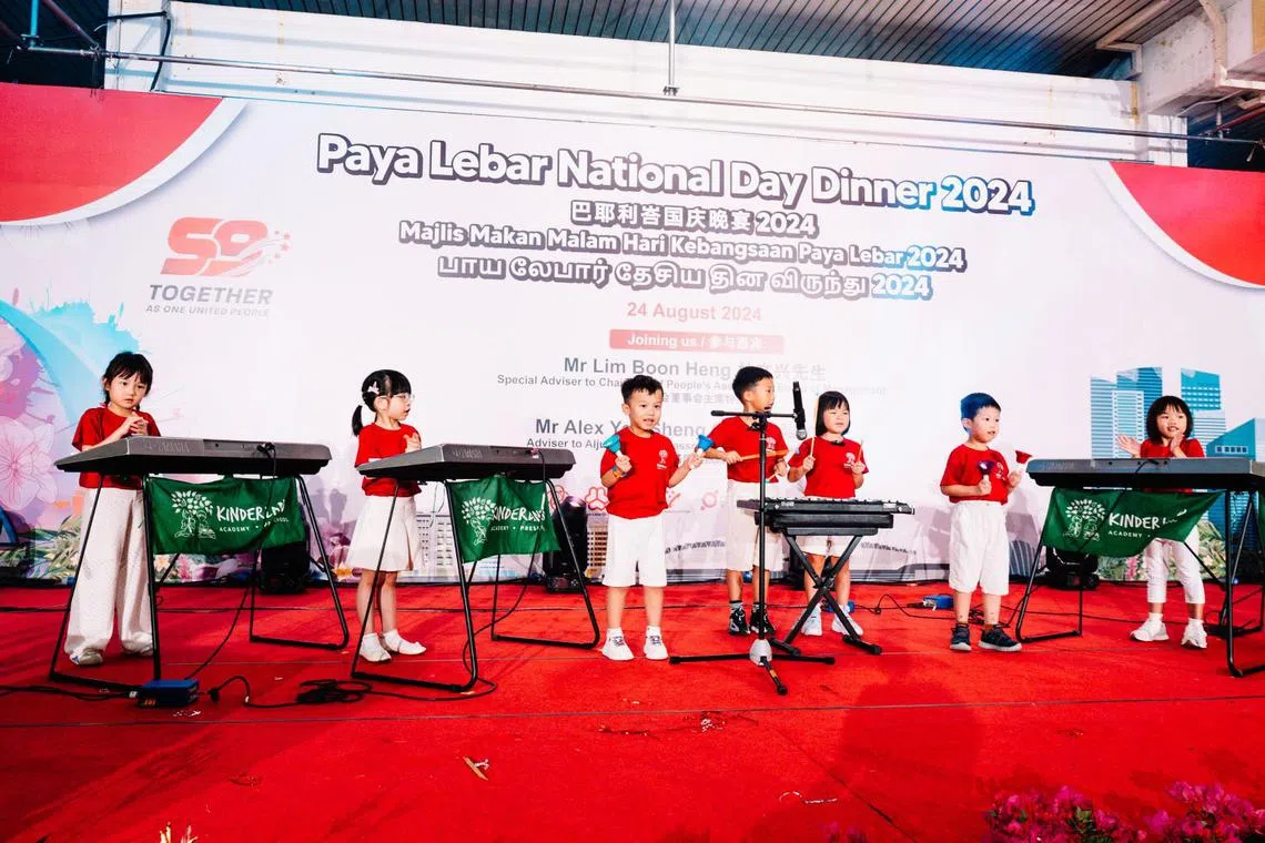 Kinderland students doing public musical performance at Paya Lebar National Day Dinner 2024